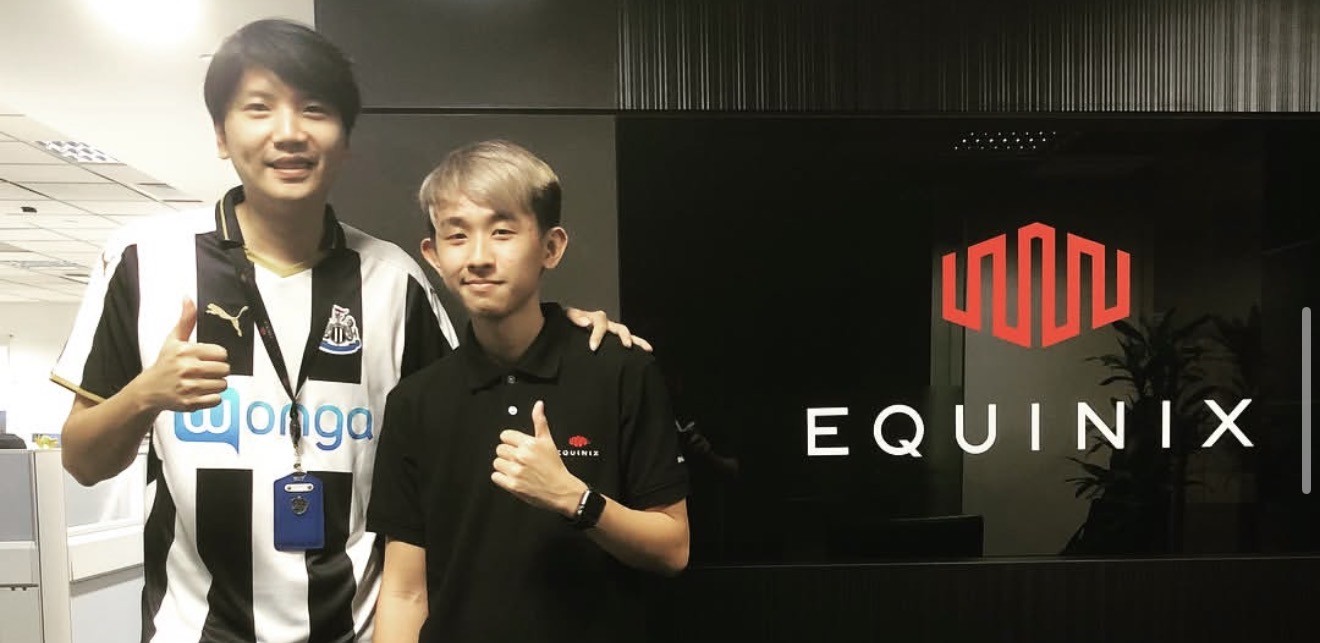 Equinix SG2 data center — Smart Hands team on the left with company logo visible on the right wall